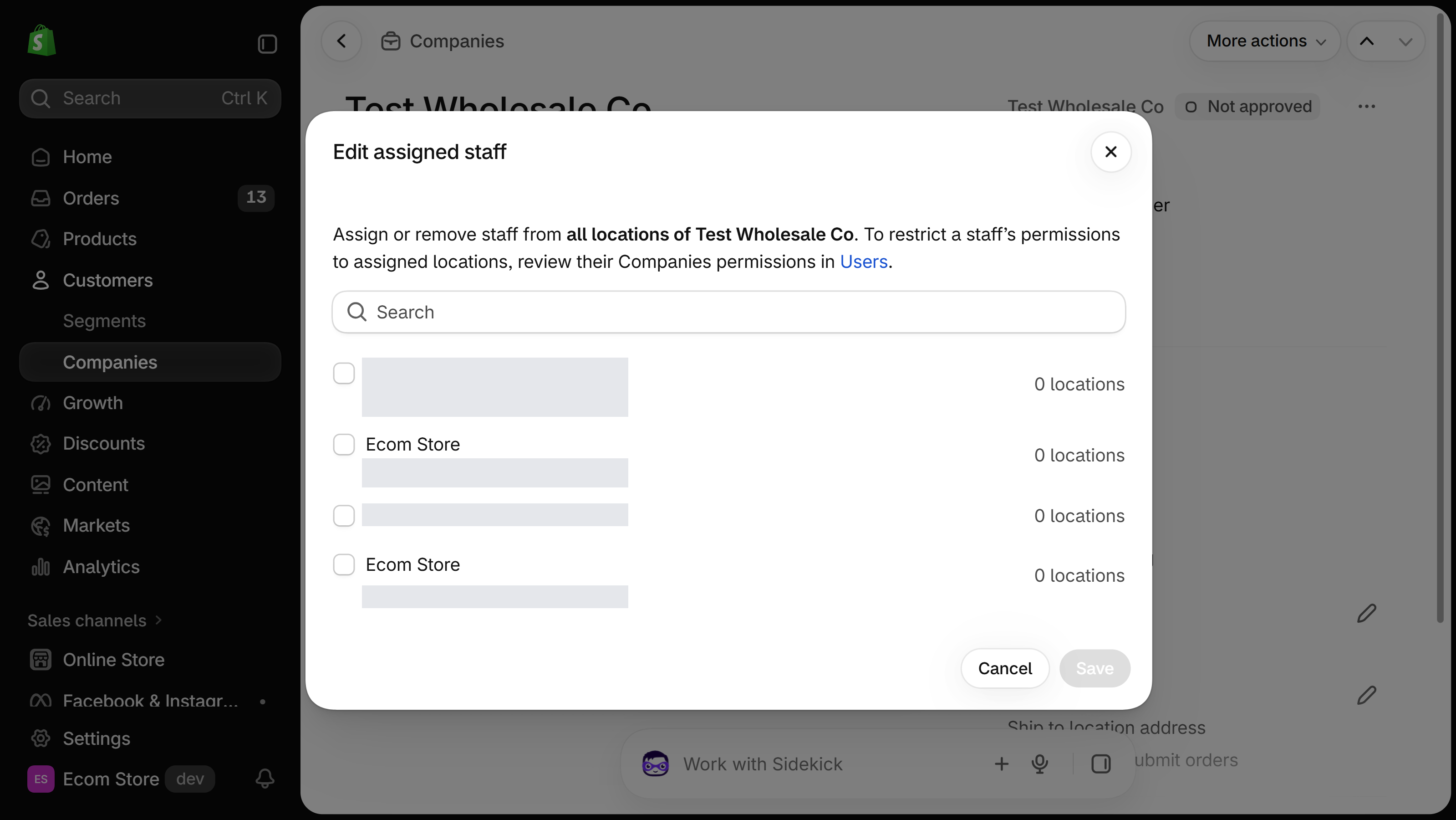 Edit assigned staff dialog on a company page in the Shopify admin, listing staff members to select
