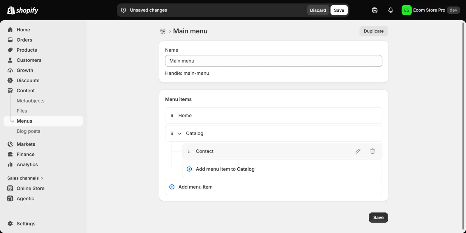 Shopify admin Content > Menus editor for Main menu: Home and Catalog as top-level items, Contact indented under Catalog as one nested level, an Add menu item to Catalog button beneath it, and the Unsaved changes bar with Discard and Save